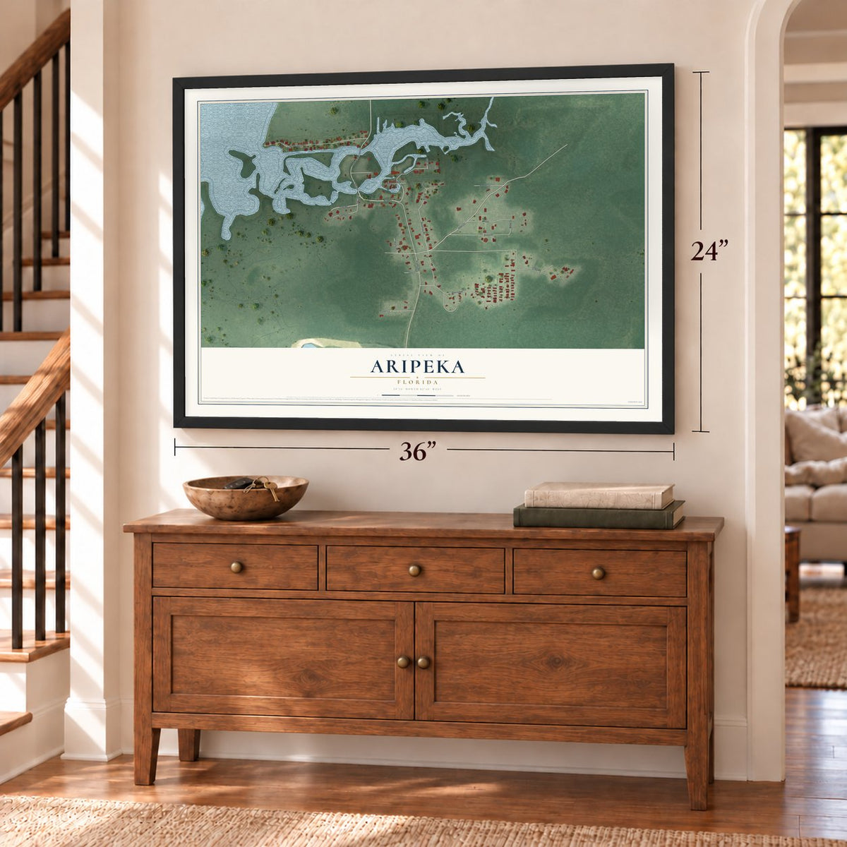 Aripeka, Florida map, 24 x 36 inch print in a black frame above a dresser by a staircase