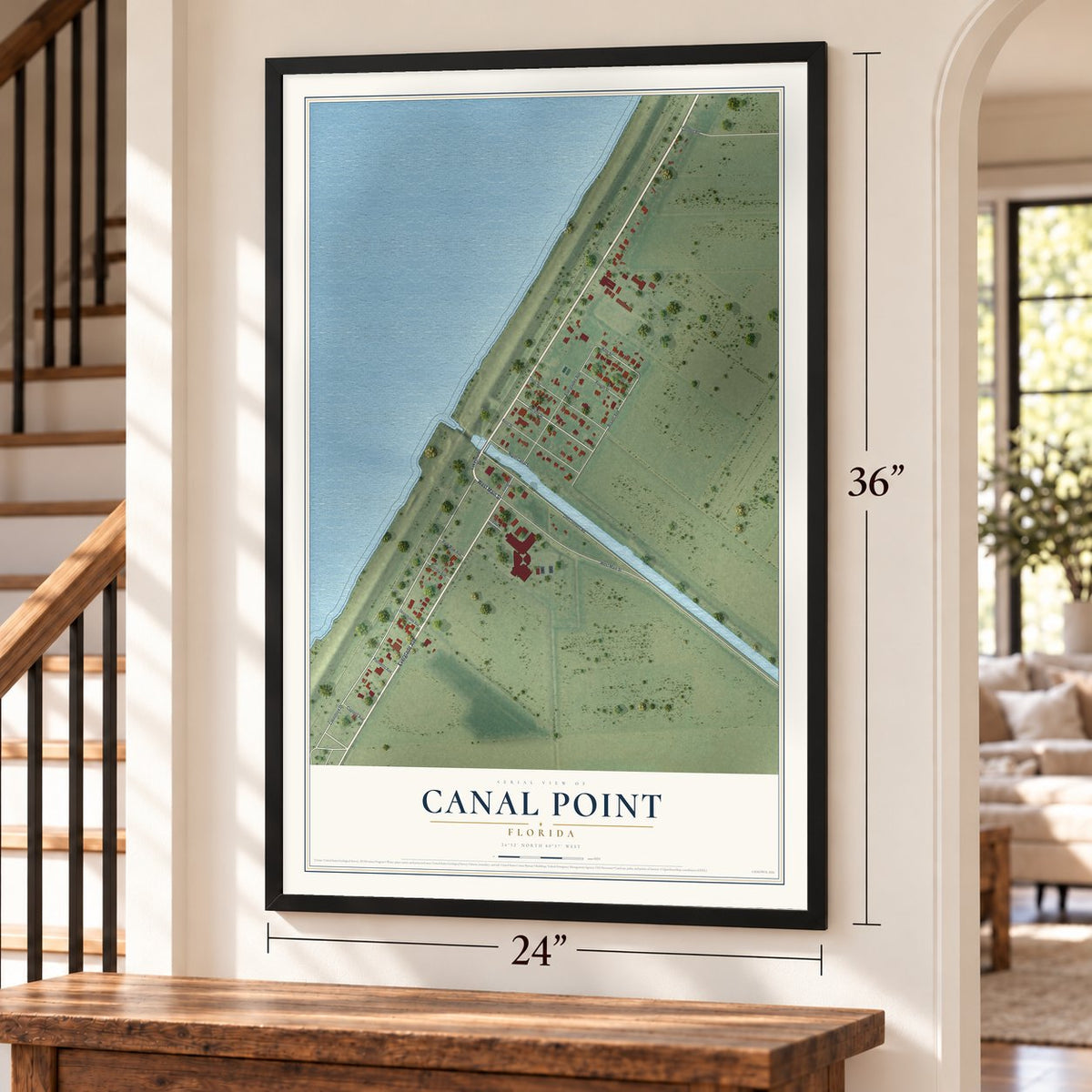 Canal Point, Florida map, 24 x 36 inch print in a black frame by a staircase