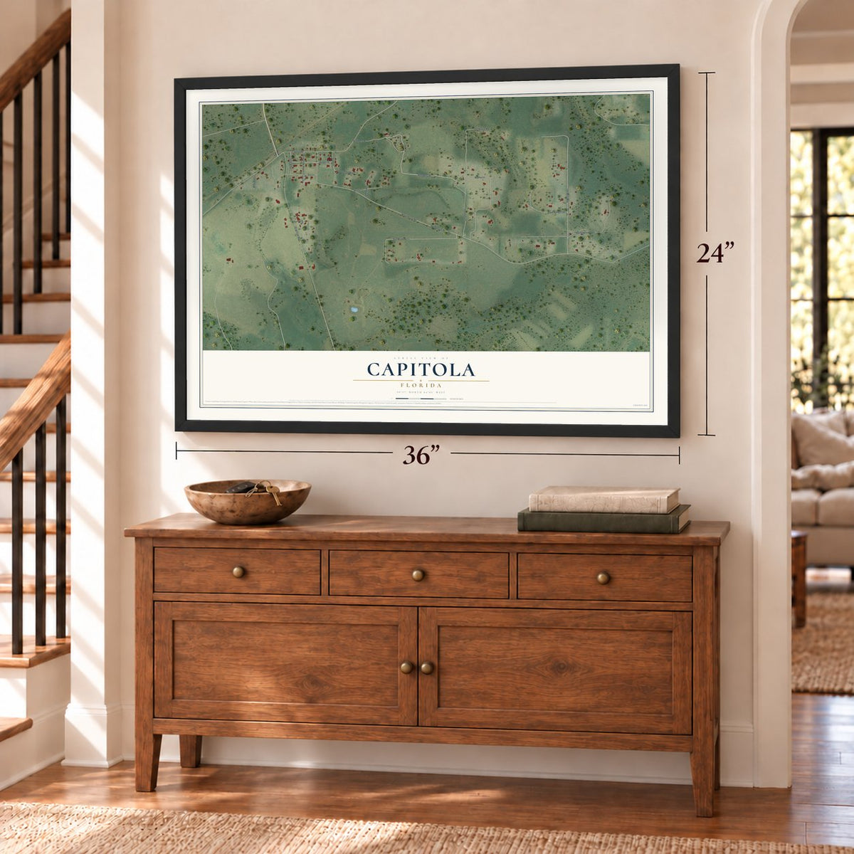 Capitola, Florida map, 24 x 36 inch print in a black frame above a dresser by a staircase
