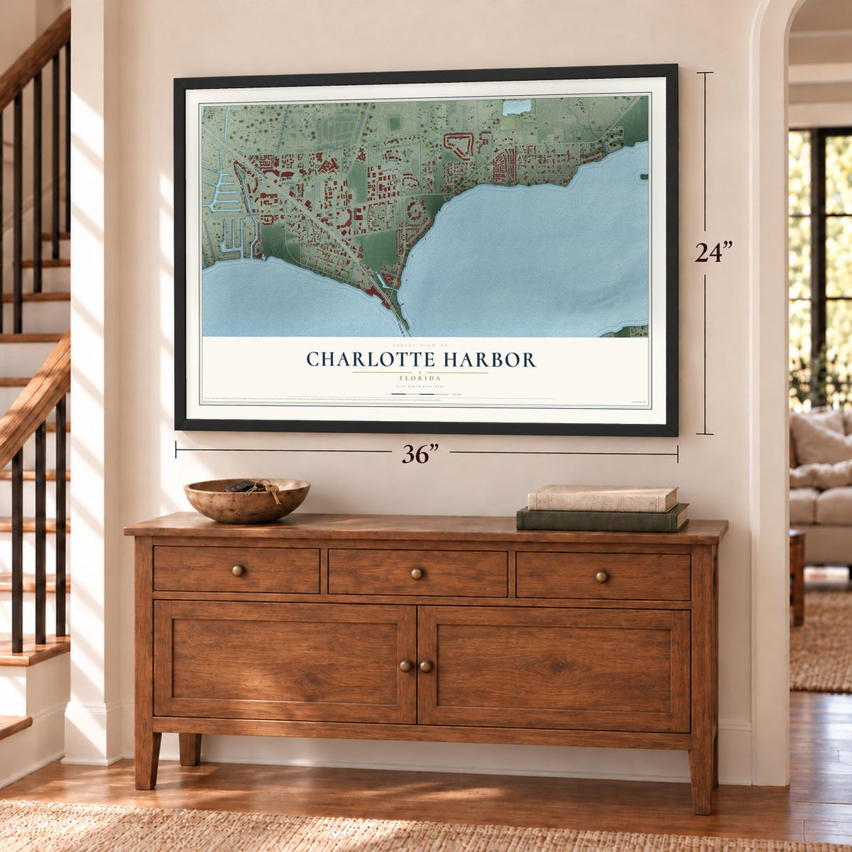 Charlotte Harbor, Florida map, 24 x 36 inch print in a black frame above a dresser by a staircase
