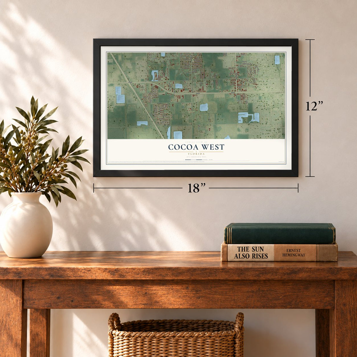 Cocoa West, Florida map, 12 x 18 inch print in a black frame in an entryway