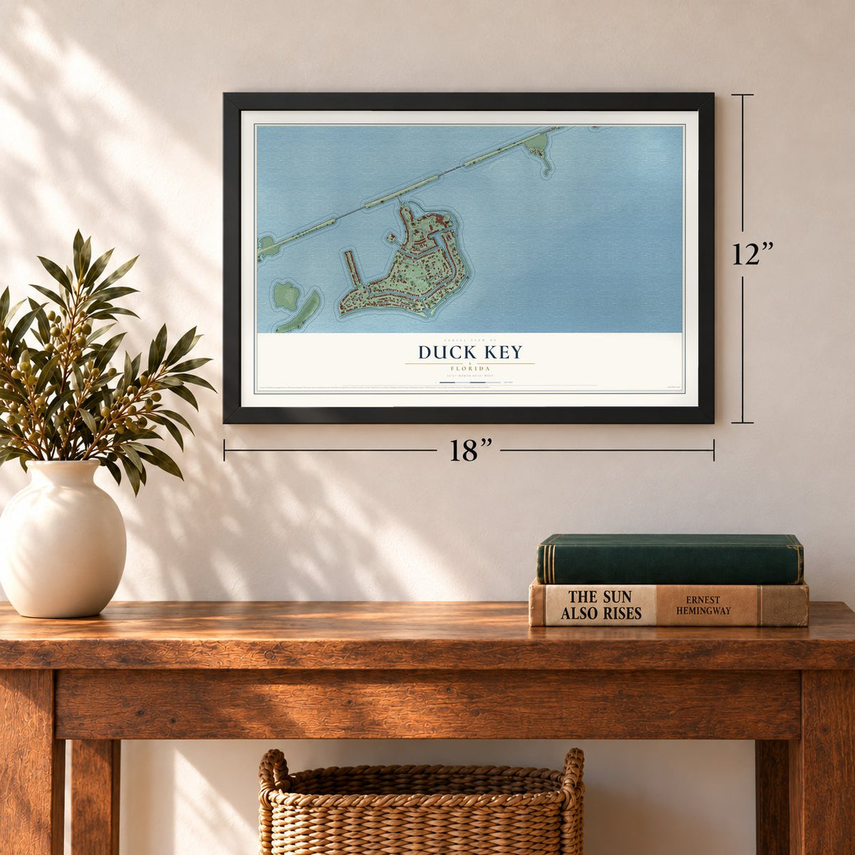 Duck Key, Florida map, 12 x 18 inch print in a black frame in an entryway