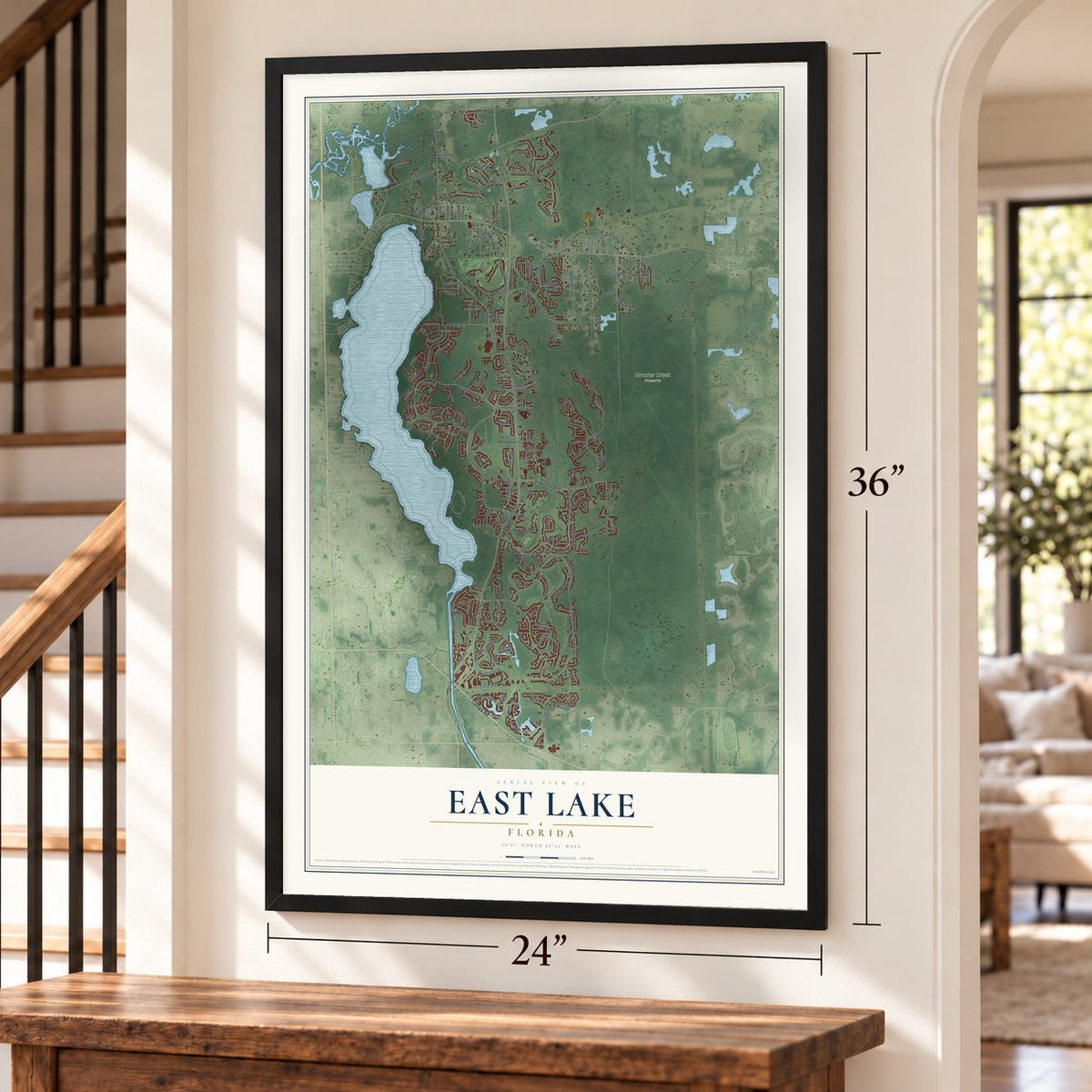 East Lake, Florida map, 24 x 36 inch print in a black frame by a staircase