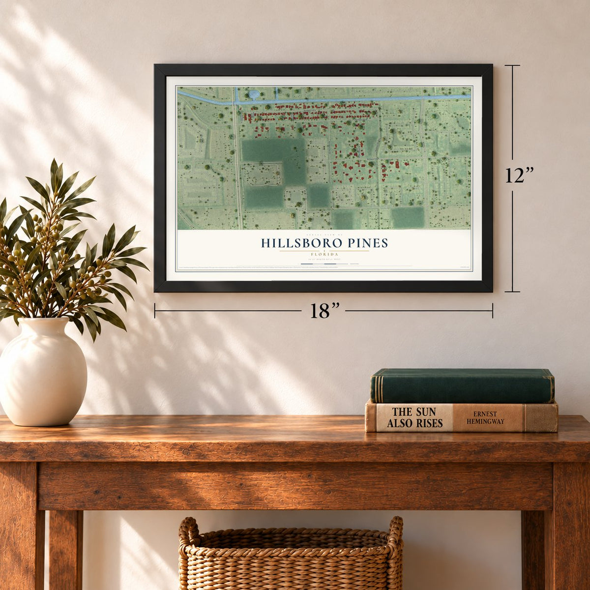 Hillsboro Pines, Florida map, 12 x 18 inch print in a black frame in an entryway
