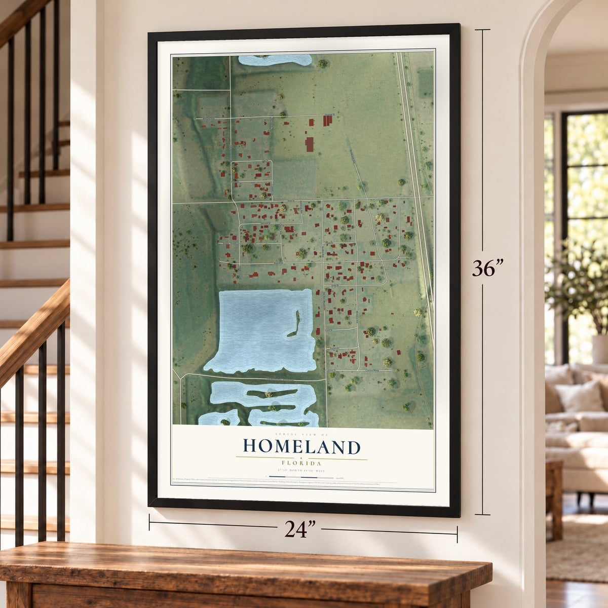 Homeland, Florida map, 24 x 36 inch print in a black frame by a staircase
