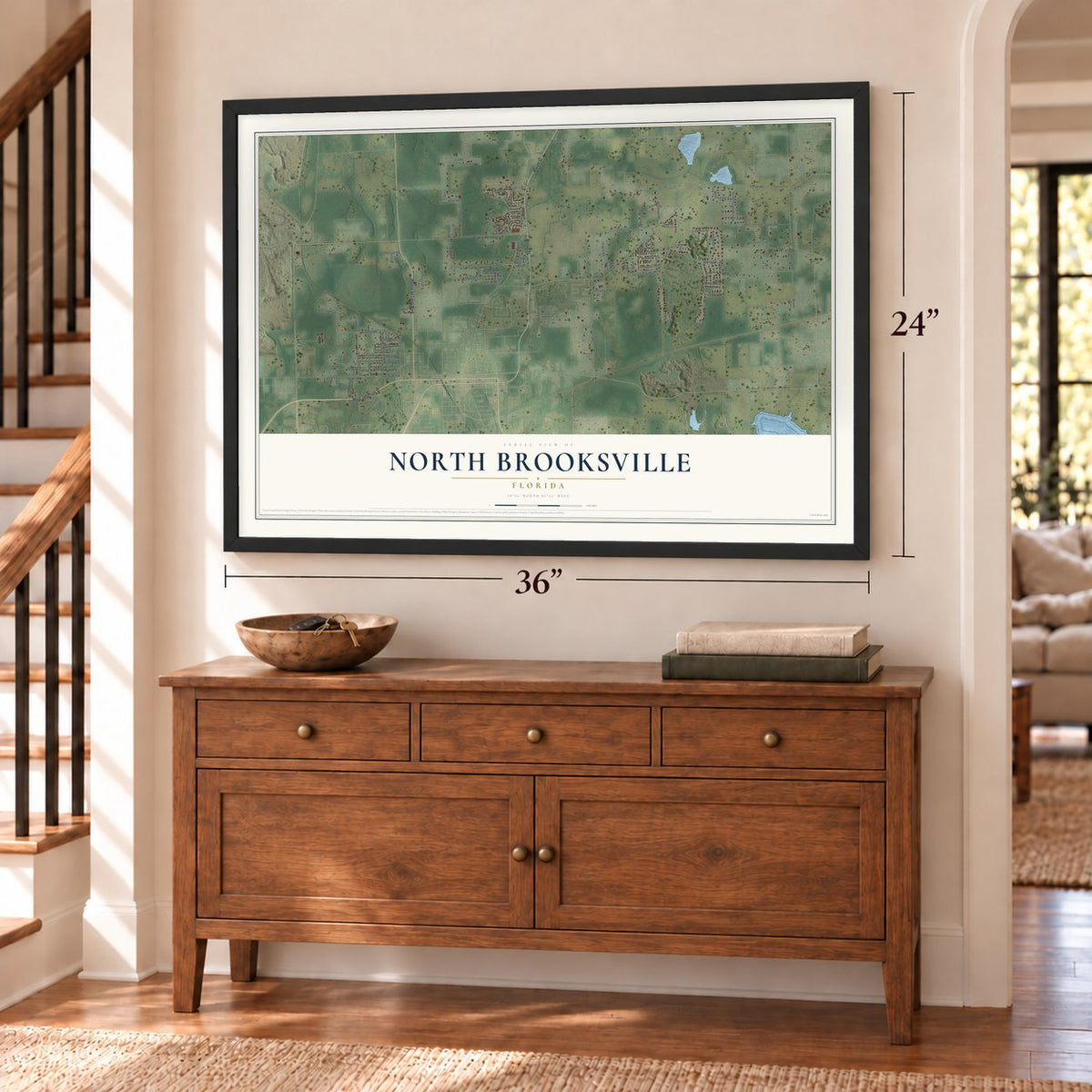 North Brooksville, Florida map, 24 x 36 inch print in a black frame above a dresser by a staircase