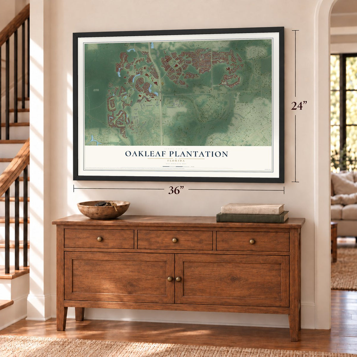 Oakleaf Plantation, Florida map, 24 x 36 inch print in a black frame above a dresser by a staircase