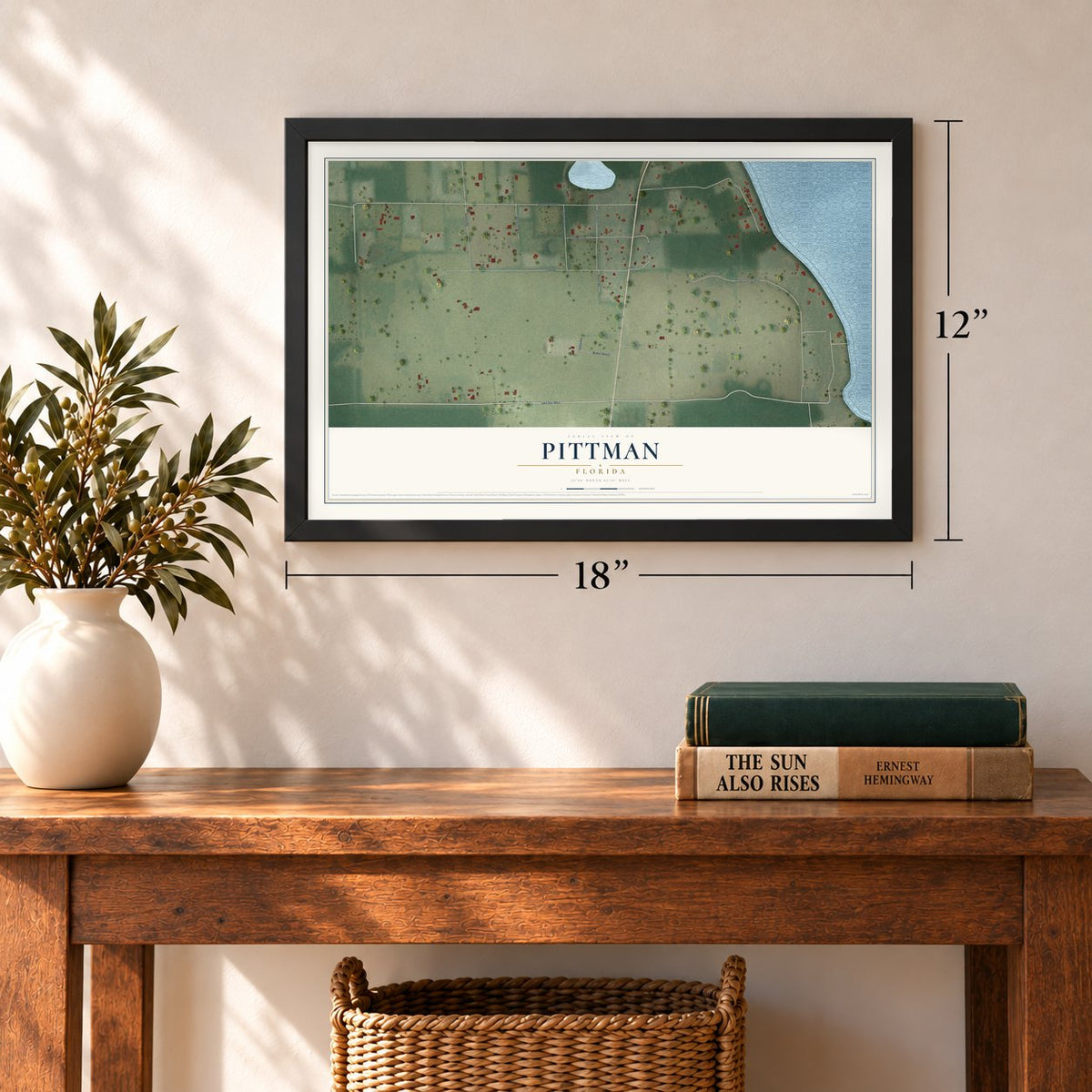 Pittman, Florida map, 12 x 18 inch print in a black frame in an entryway