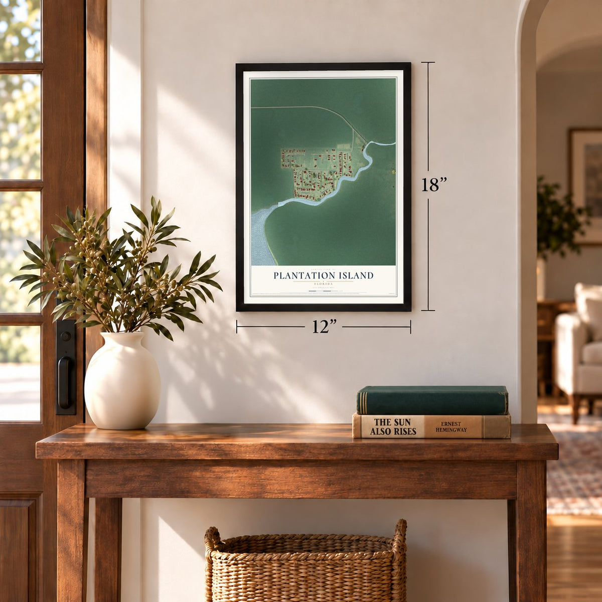 Plantation Island, Florida map, 12 x 18 inch print in a black frame in an entryway