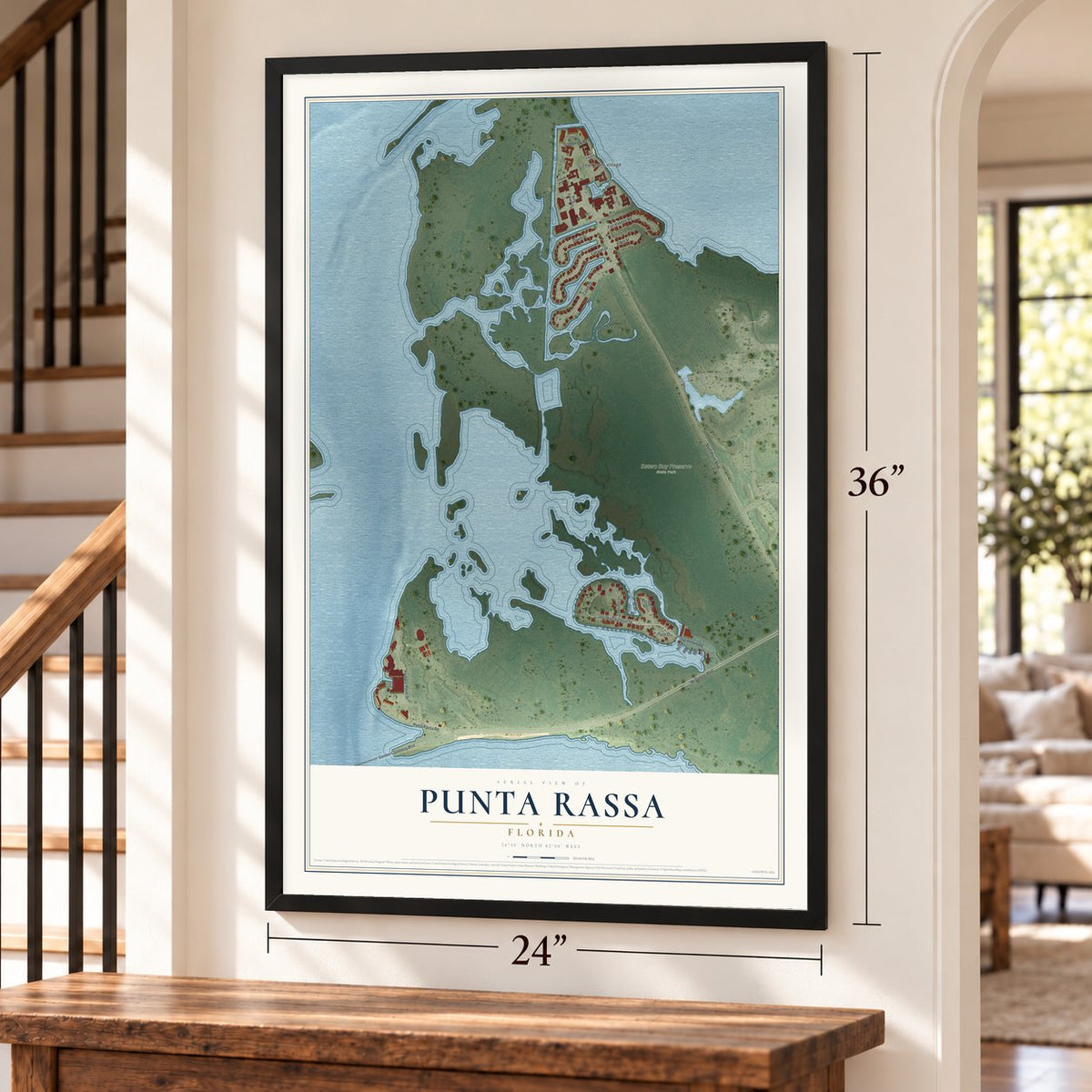 Punta Rassa, Florida map, 24 x 36 inch print in a black frame by a staircase