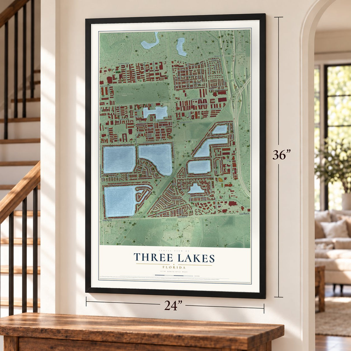 Three Lakes, Florida map, 24 x 36 inch print in a black frame by a staircase