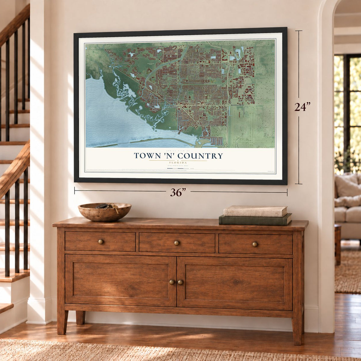 Town 'n' Country, Florida map, 24 x 36 inch print in a black frame above a dresser by a staircase