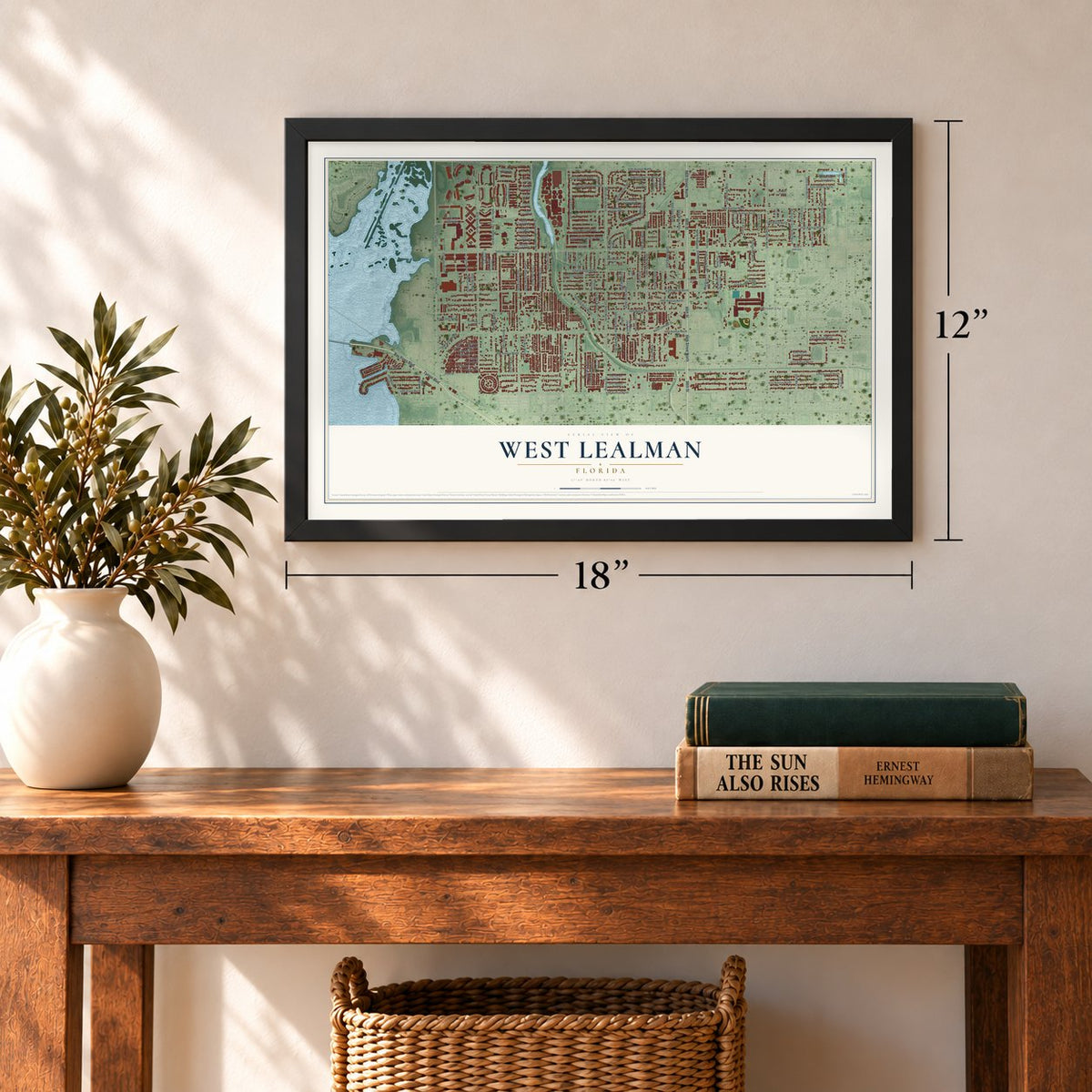 West Lealman, Florida map, 12 x 18 inch print in a black frame in an entryway