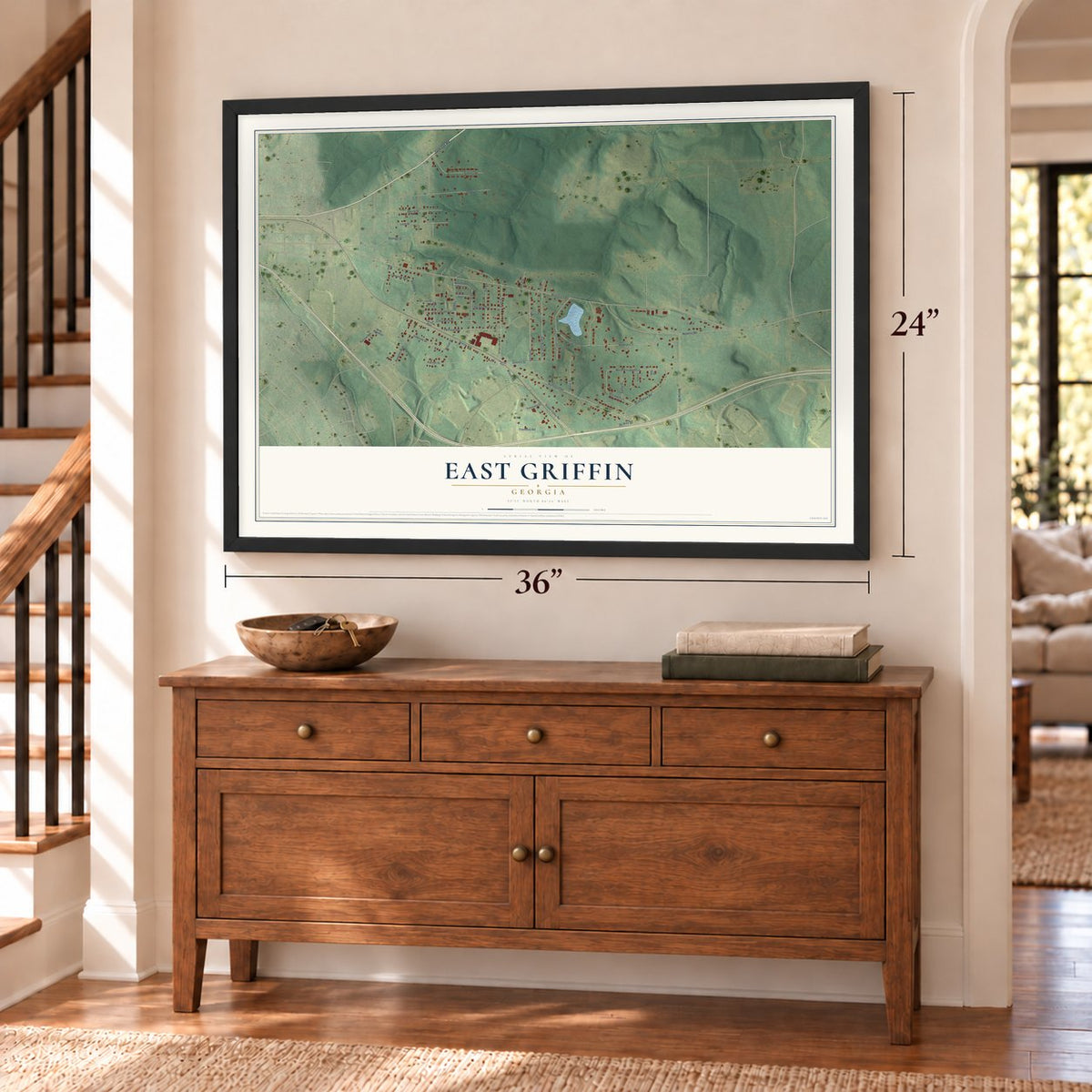 East Griffin, Georgia map, 24 x 36 inch print in a black frame above a dresser by a staircase