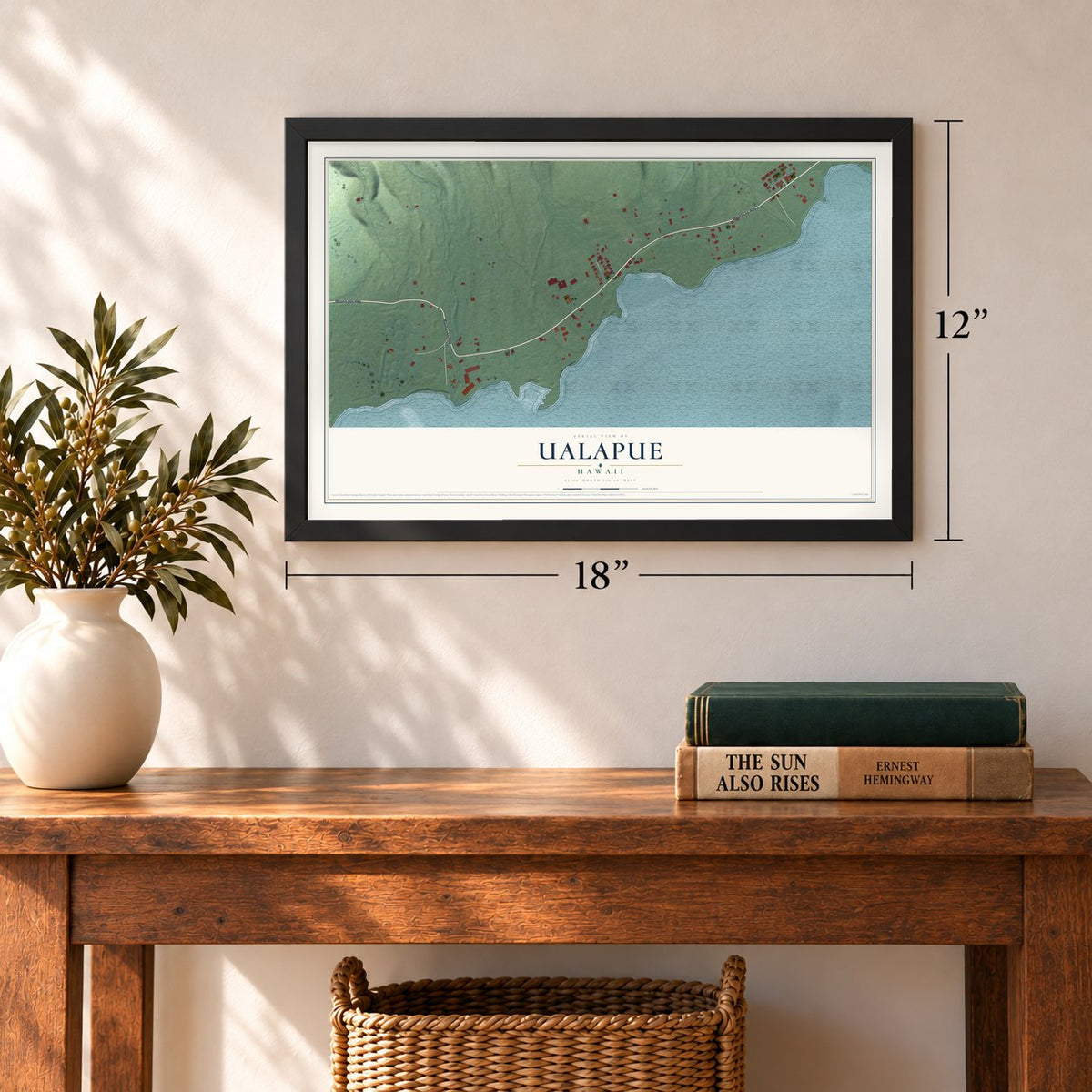 Ualapue, Hawaii map, 12 x 18 inch print in a black frame in an entryway