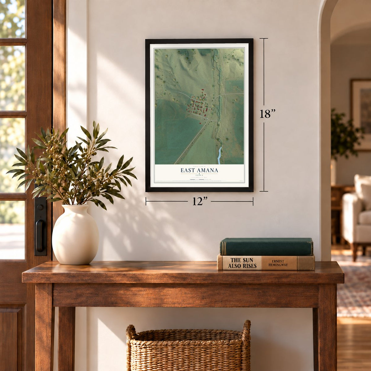 East Amana, Iowa map, 12 x 18 inch print in a black frame in an entryway