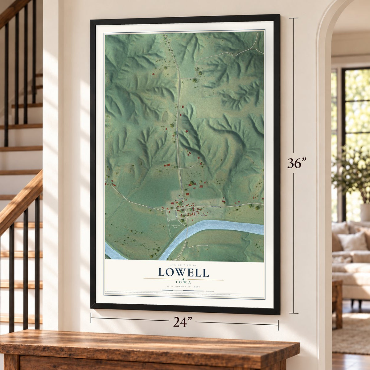 Lowell, Iowa map, 24 x 36 inch print in a black frame by a staircase