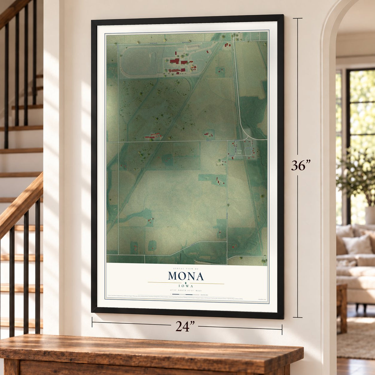 Mona, Iowa map, 24 x 36 inch print in a black frame by a staircase