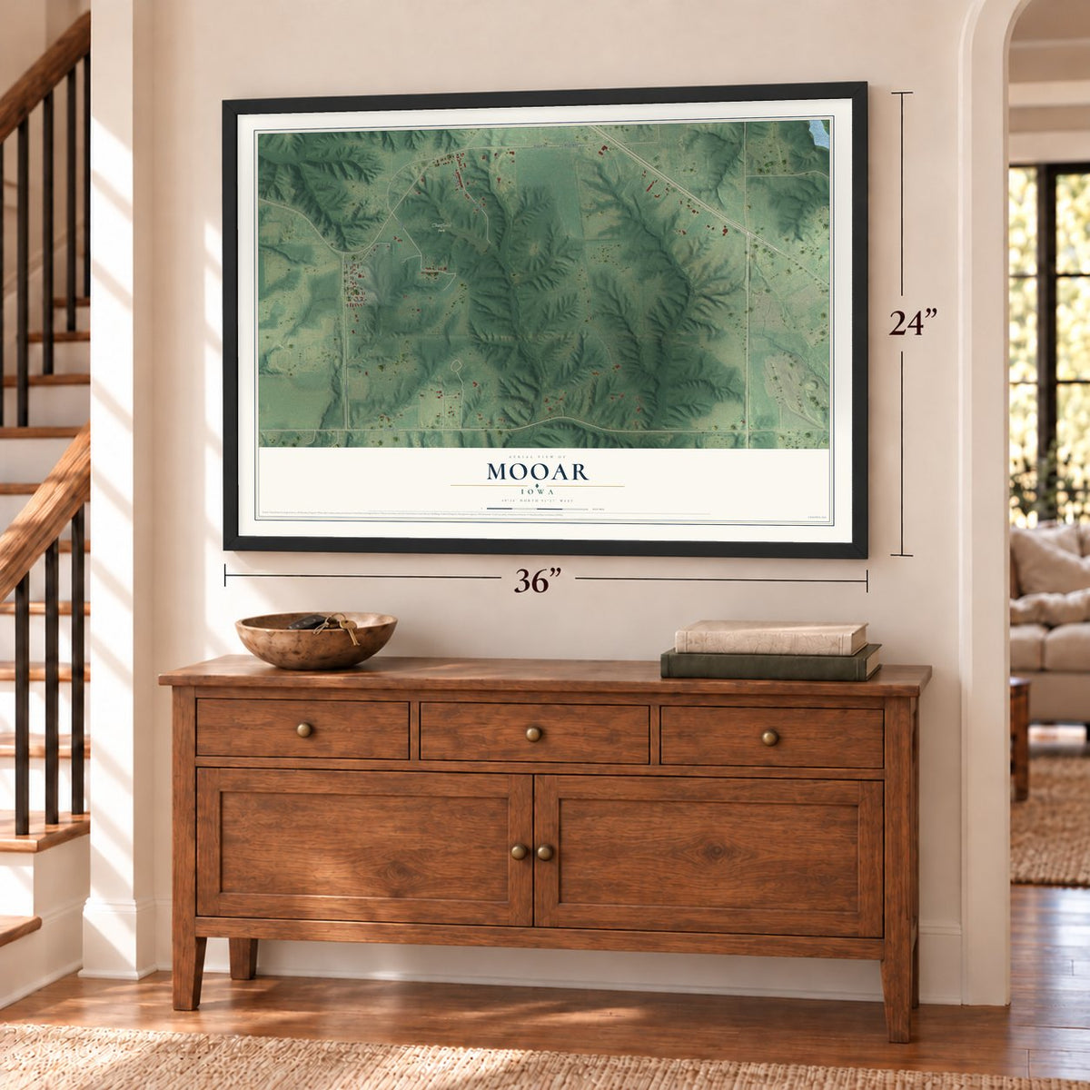 Mooar, Iowa map, 24 x 36 inch print in a black frame above a dresser by a staircase