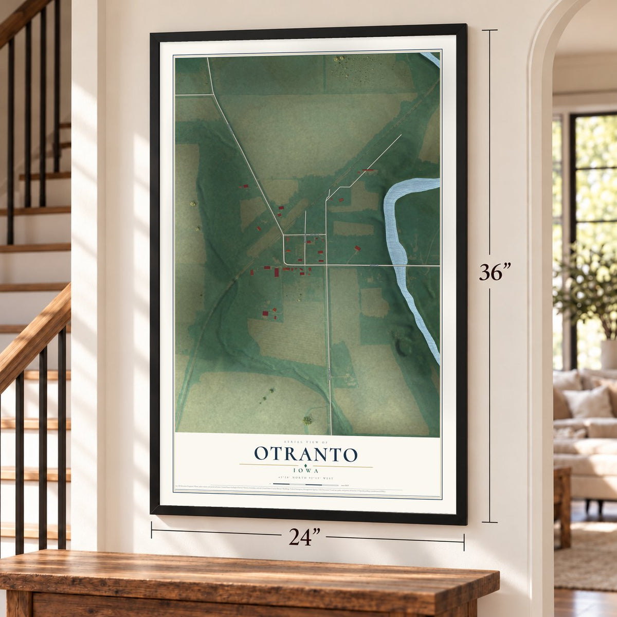 Otranto, Iowa map, 24 x 36 inch print in a black frame by a staircase