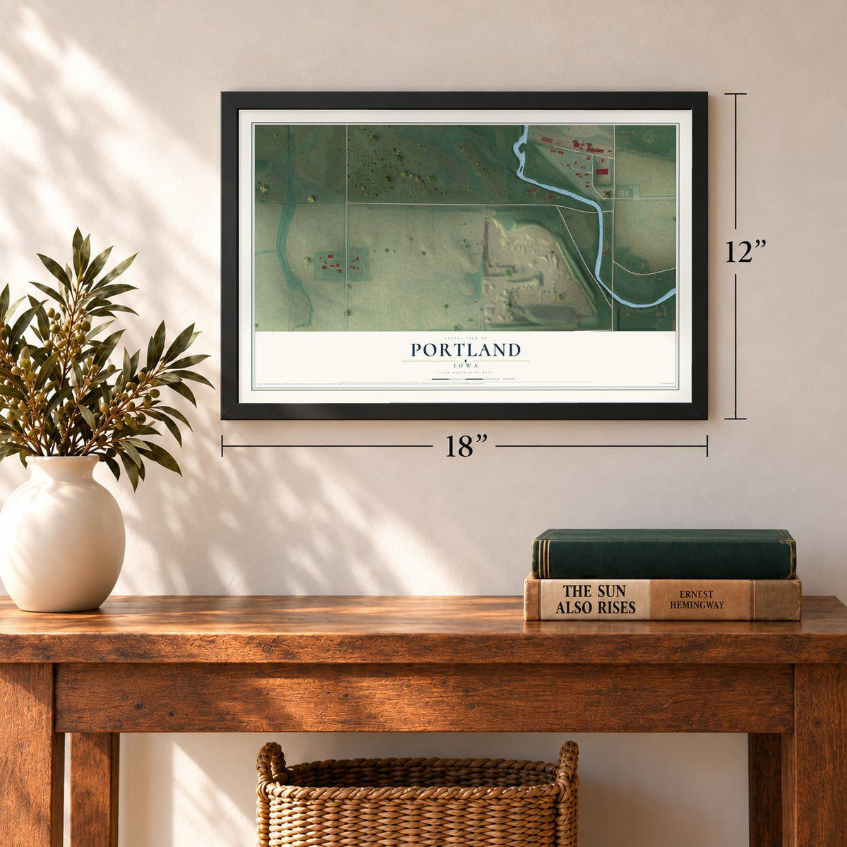 Portland, Iowa map, 12 x 18 inch print in a black frame in an entryway