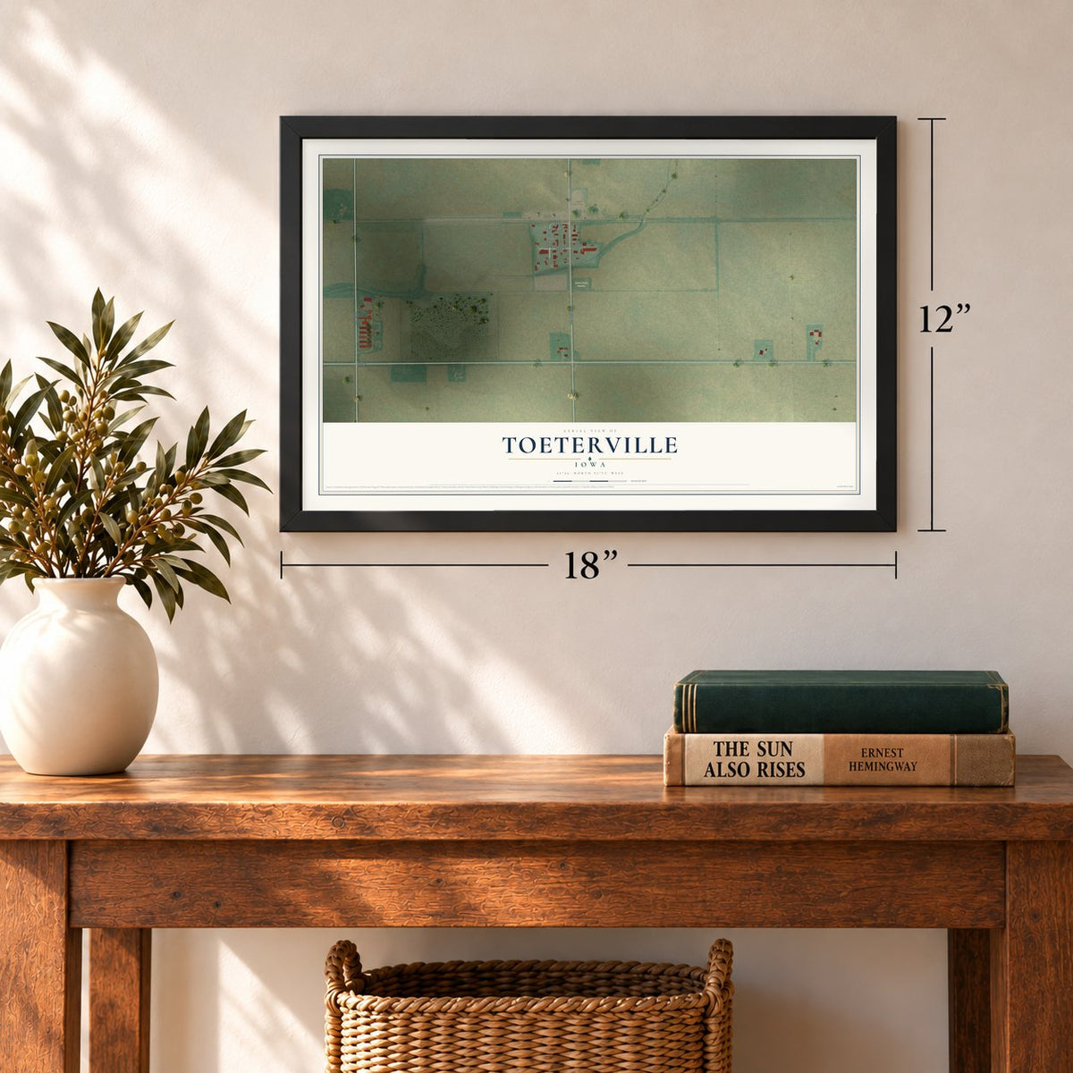 Toeterville, Iowa map, 12 x 18 inch print in a black frame in an entryway