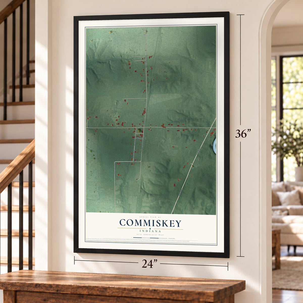 Commiskey, Indiana map, 24 x 36 inch print in a black frame by a staircase