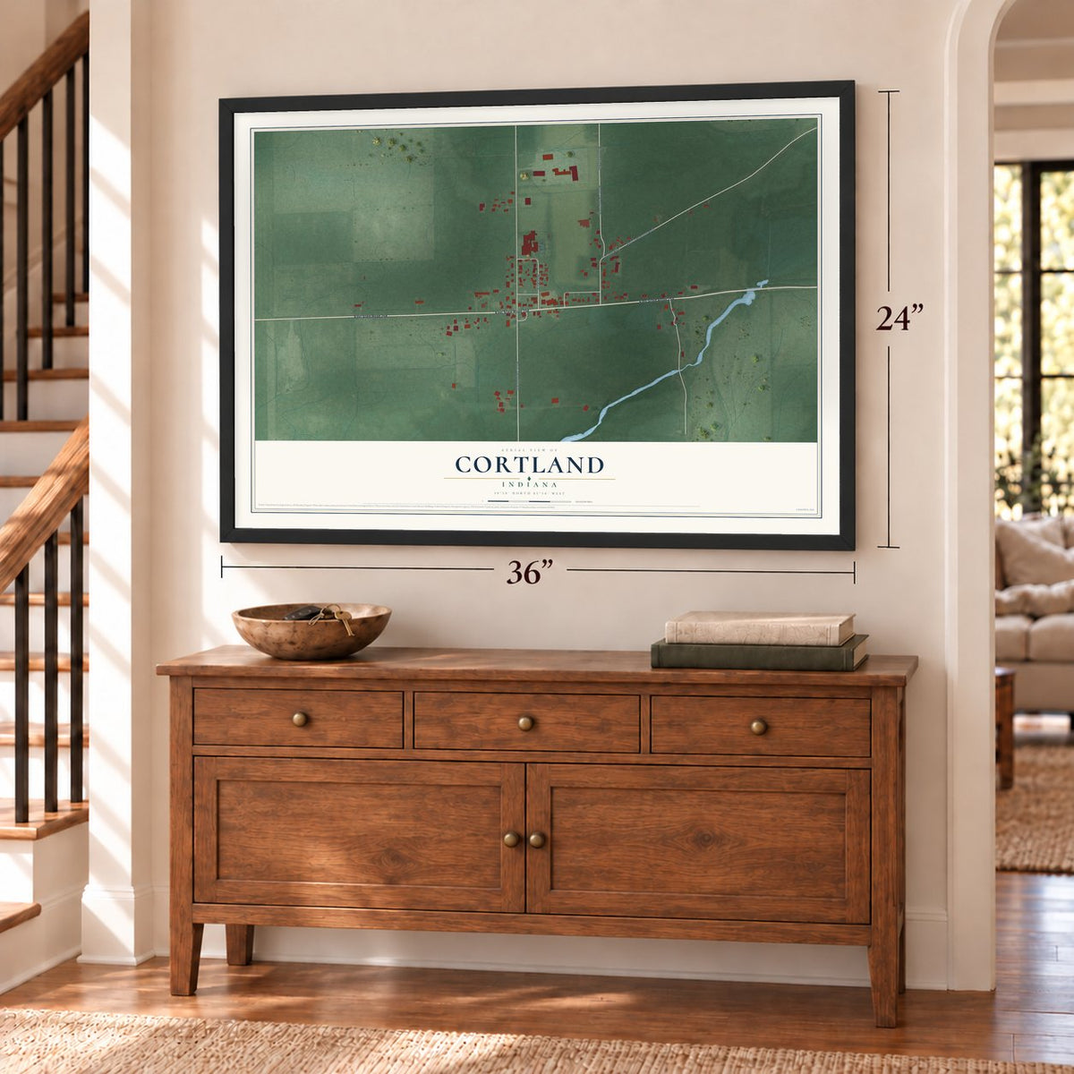 Cortland, Indiana map, 24 x 36 inch print in a black frame above a dresser by a staircase