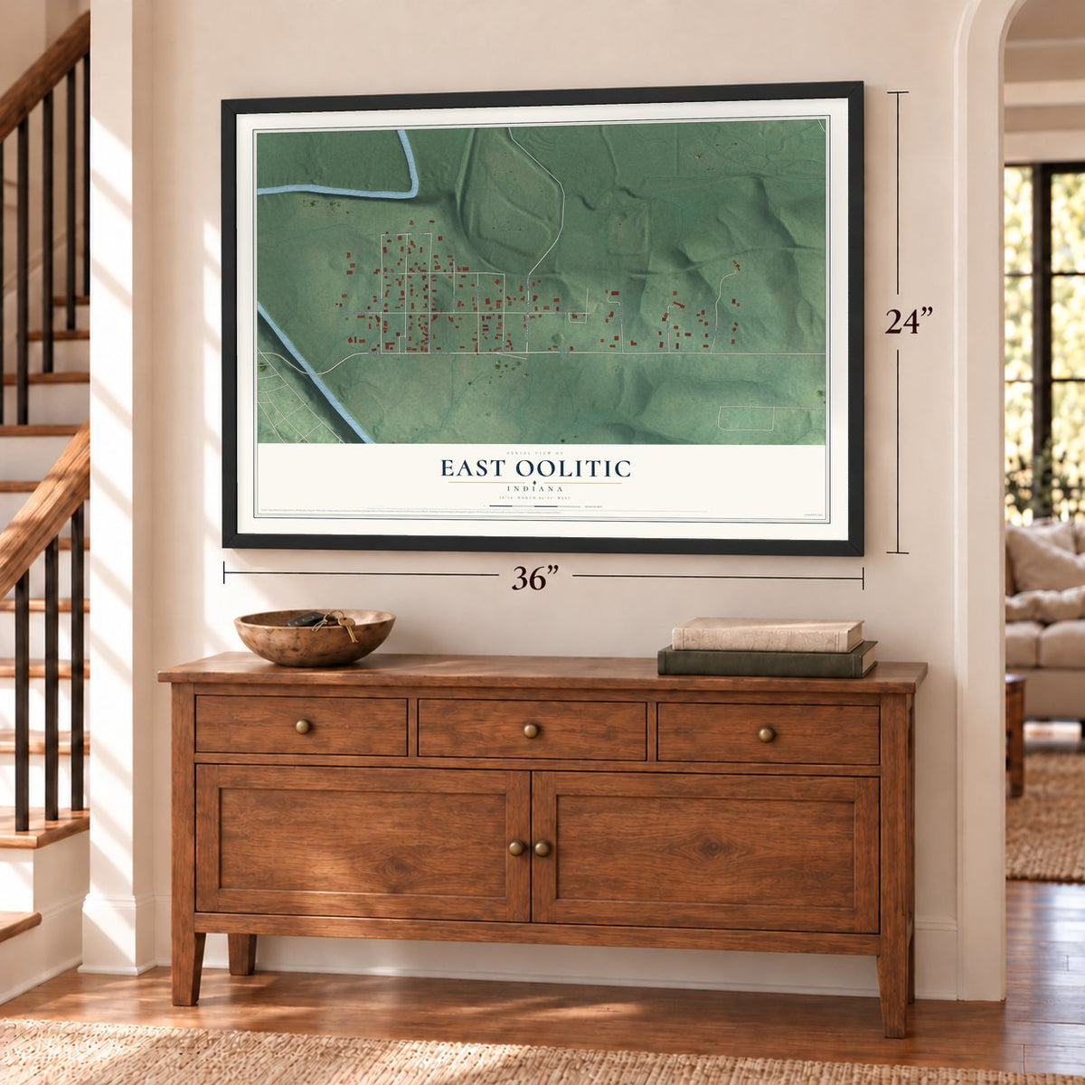 East Oolitic, Indiana map, 24 x 36 inch print in a black frame above a dresser by a staircase