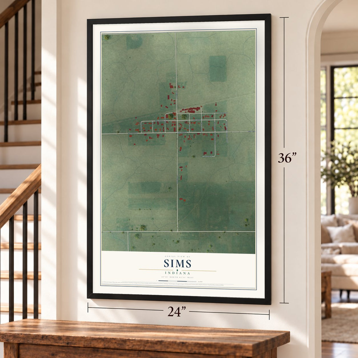Sims, Indiana map, 24 x 36 inch print in a black frame by a staircase
