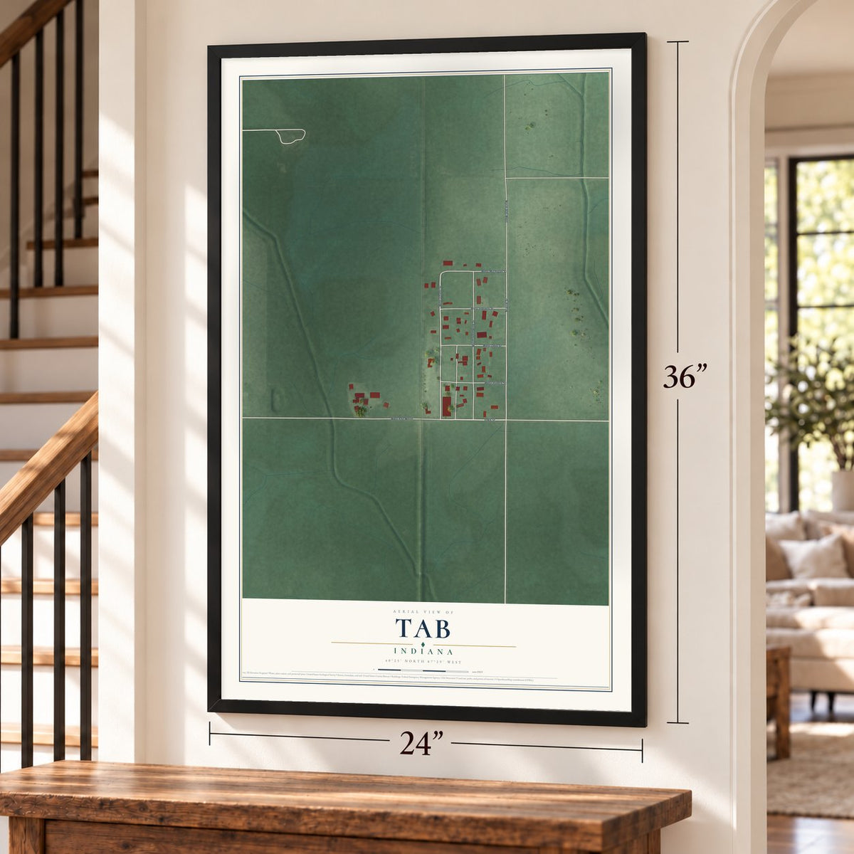 Tab, Indiana map, 24 x 36 inch print in a black frame by a staircase