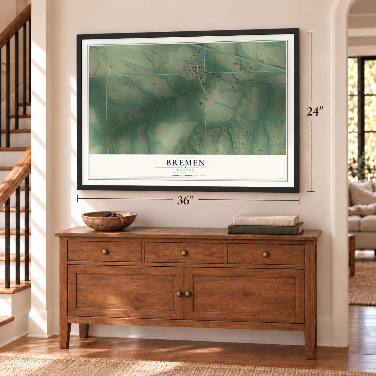 Bremen, Kansas map, 24 x 36 inch print in a black frame above a dresser by a staircase