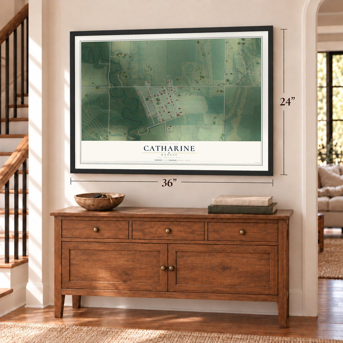 Catharine, Kansas map, 24 x 36 inch print in a black frame above a dresser by a staircase