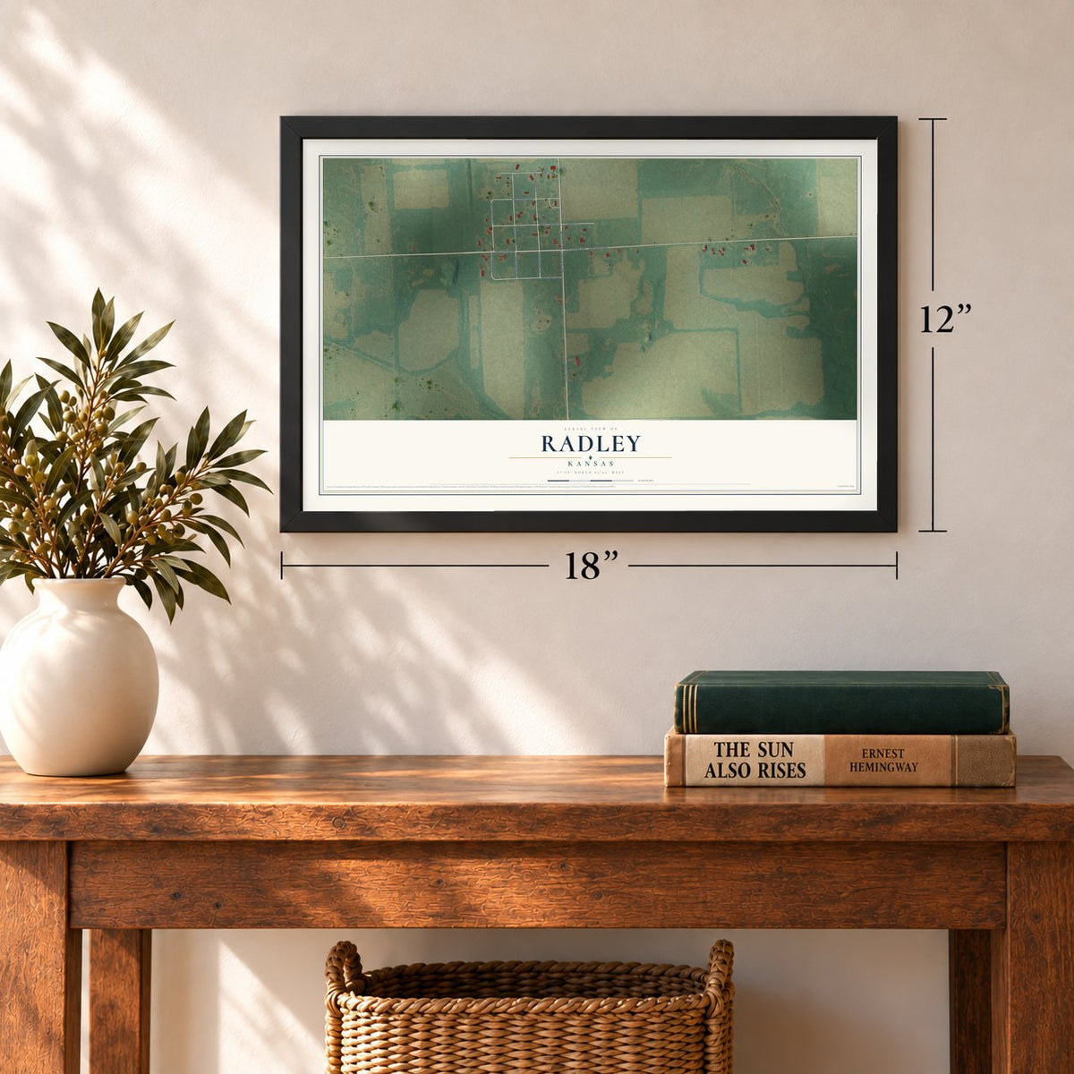 Radley, Kansas map, 12 x 18 inch print in a black frame in an entryway