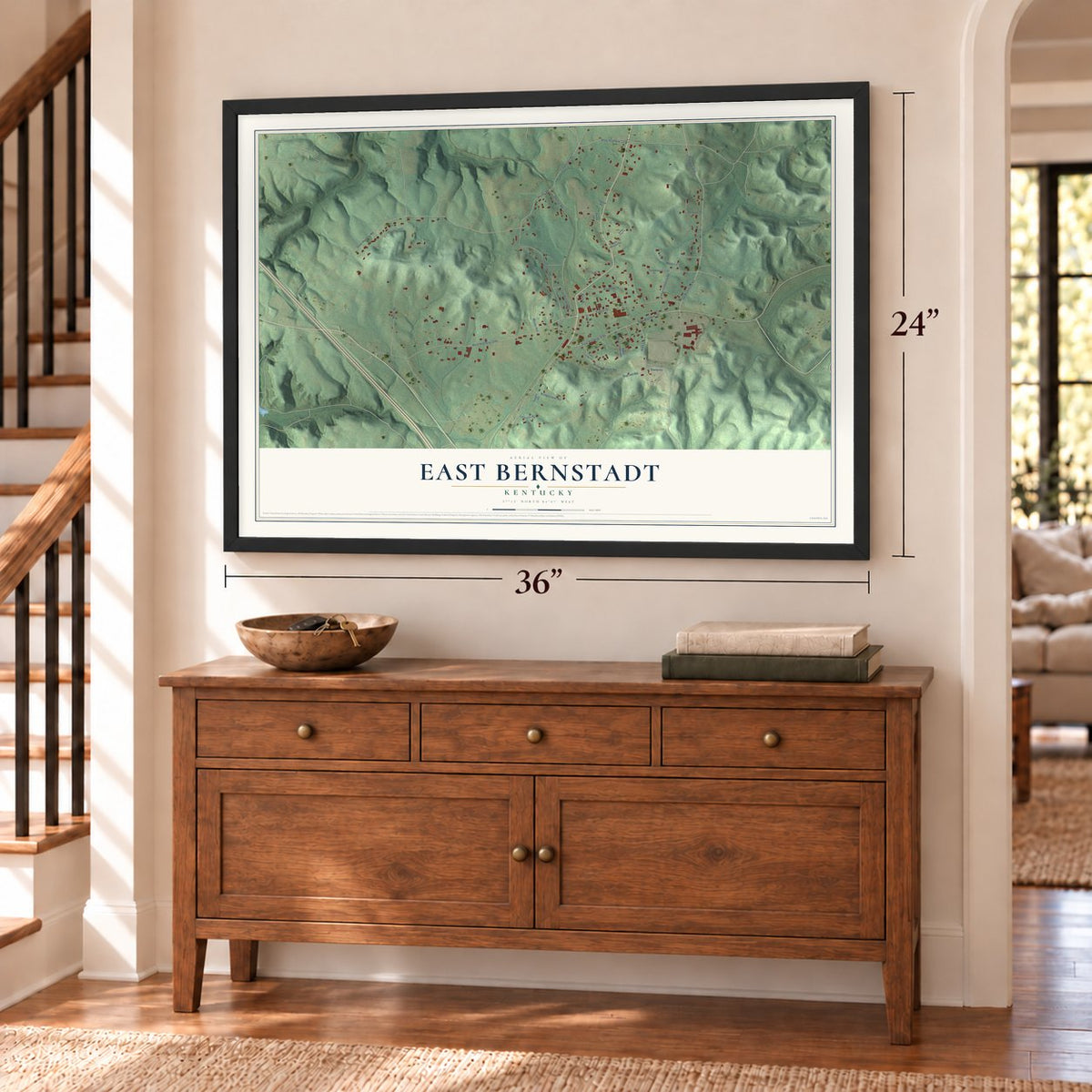 East Bernstadt, Kentucky map, 24 x 36 inch print in a black frame above a dresser by a staircase
