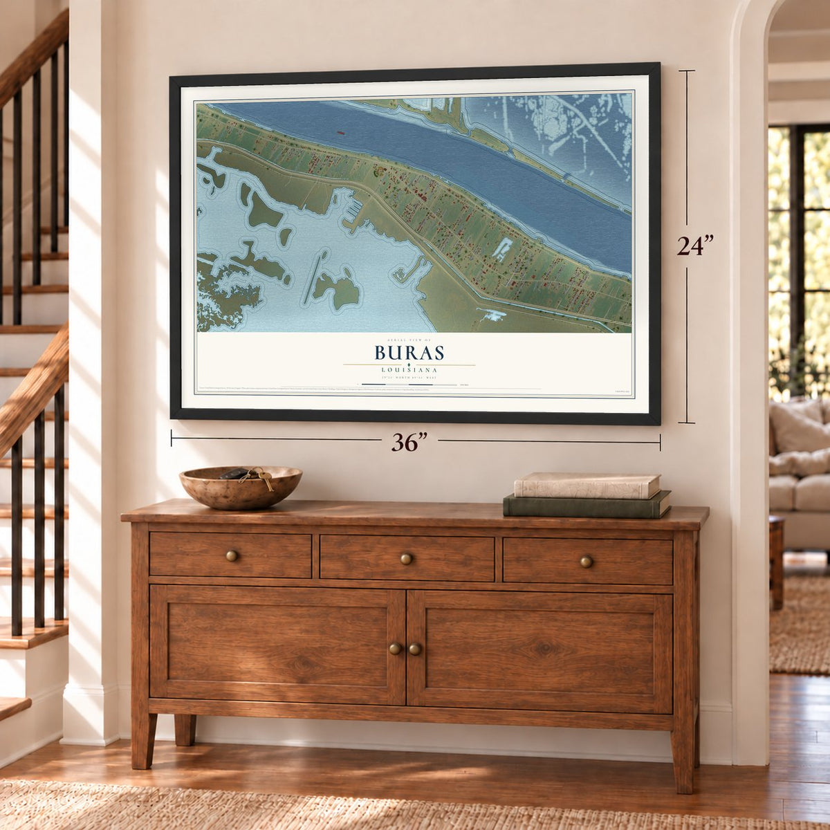 Buras, Louisiana map, 24 x 36 inch print in a black frame above a dresser by a staircase