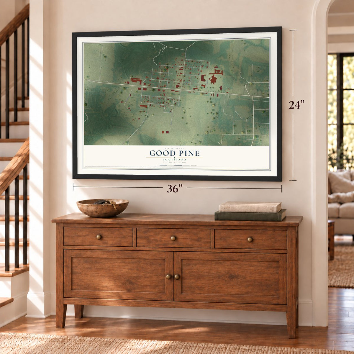 Good Pine, Louisiana map, 24 x 36 inch print in a black frame above a dresser by a staircase