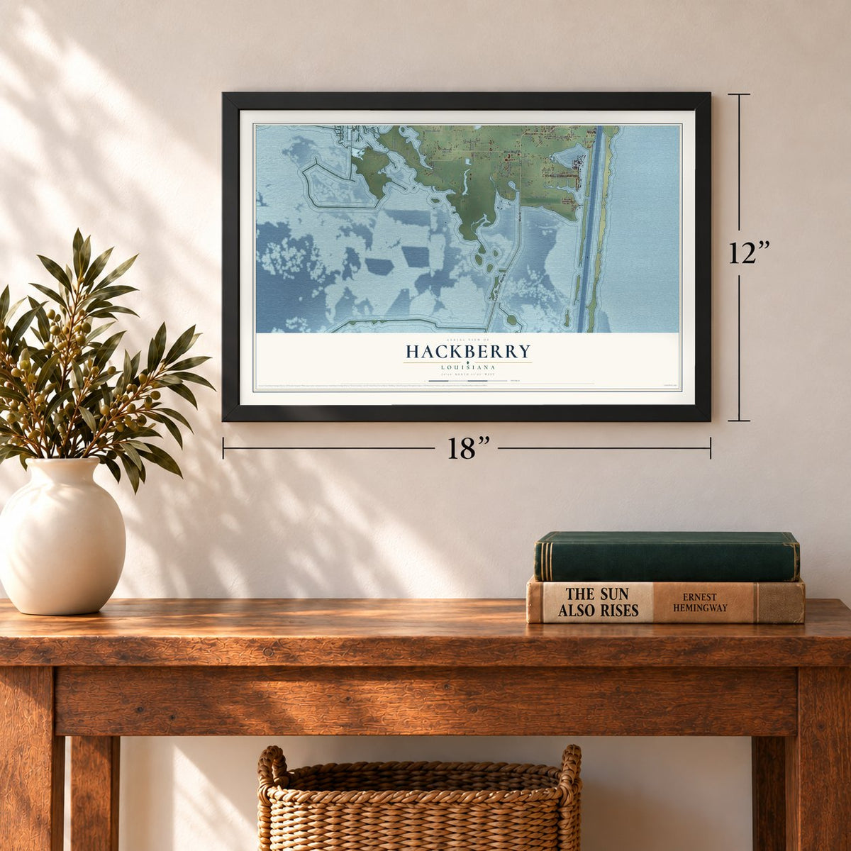 Hackberry, Louisiana map, 12 x 18 inch print in a black frame in an entryway