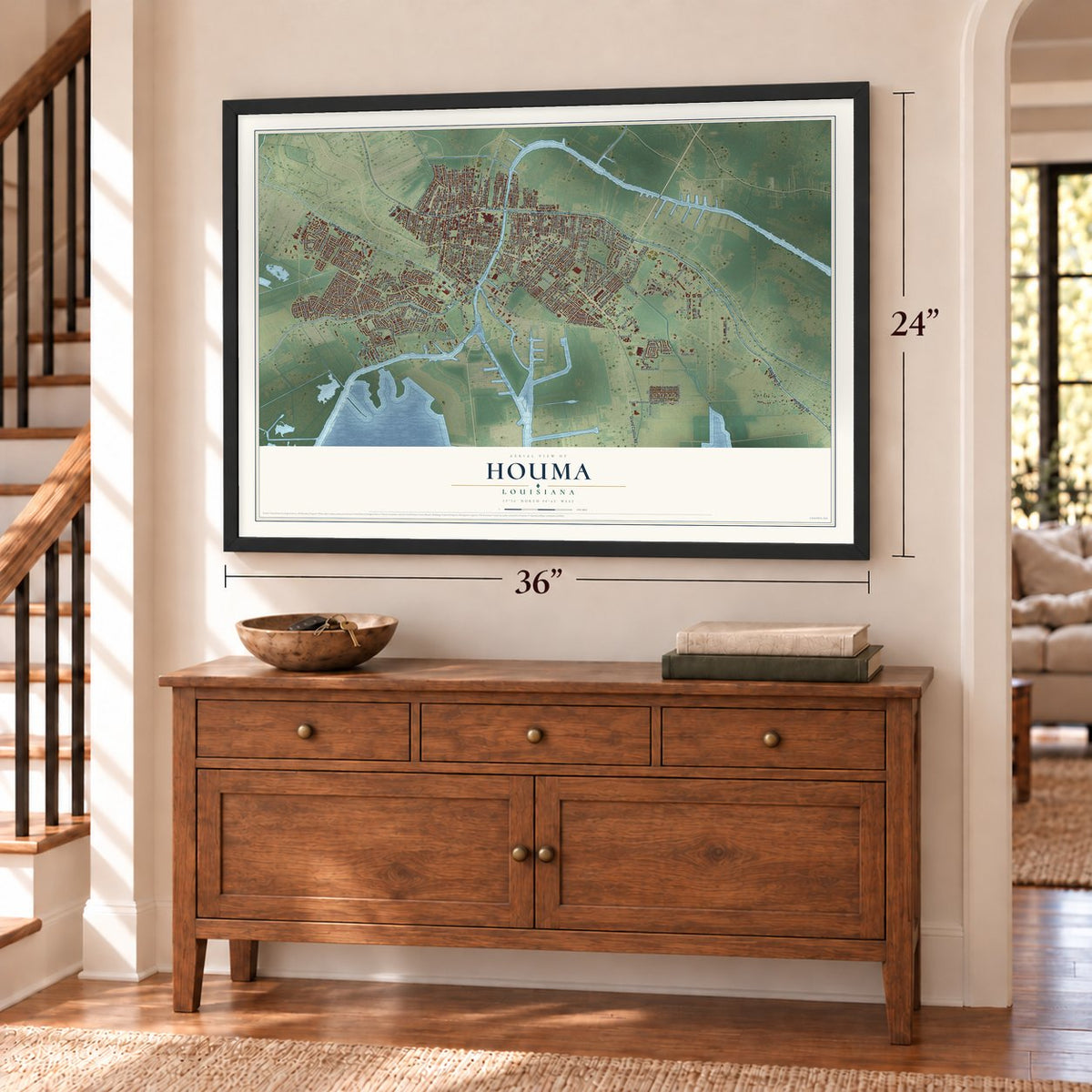 Houma, Louisiana map, 24 x 36 inch print in a black frame above a dresser by a staircase