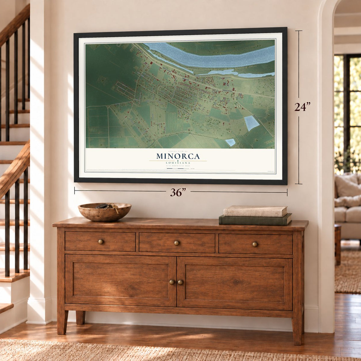 Minorca, Louisiana map, 24 x 36 inch print in a black frame above a dresser by a staircase