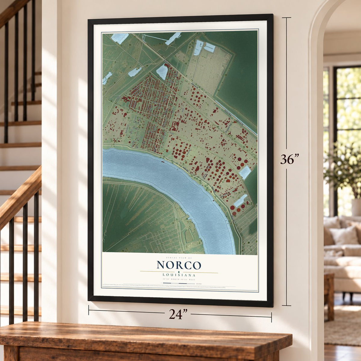 Norco, Louisiana map, 24 x 36 inch print in a black frame by a staircase