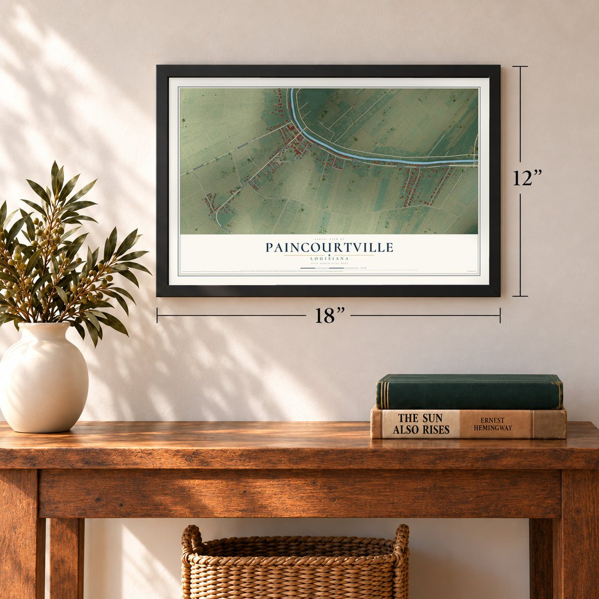 Paincourtville, Louisiana map, 12 x 18 inch print in a black frame in an entryway