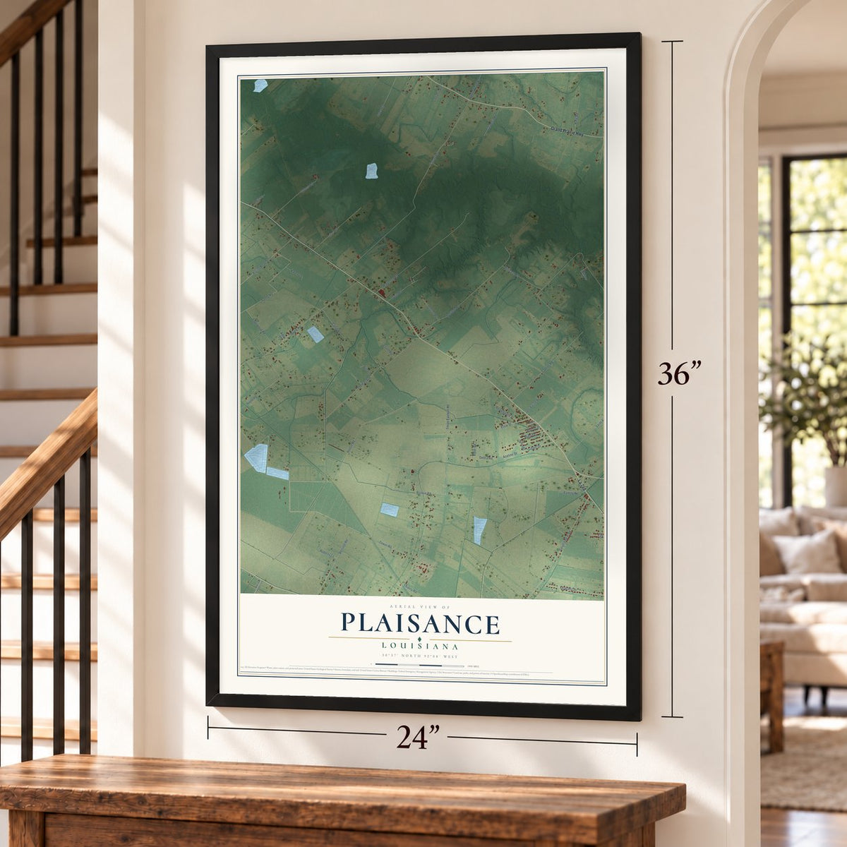 Plaisance, Louisiana map, 24 x 36 inch print in a black frame by a staircase