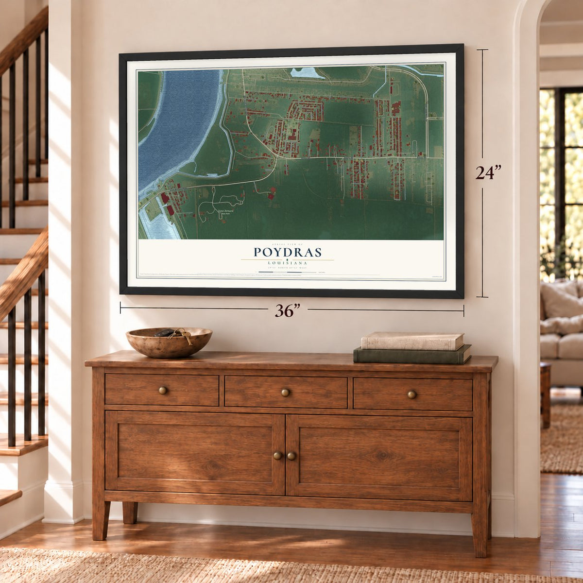 Poydras, Louisiana map, 24 x 36 inch print in a black frame above a dresser by a staircase