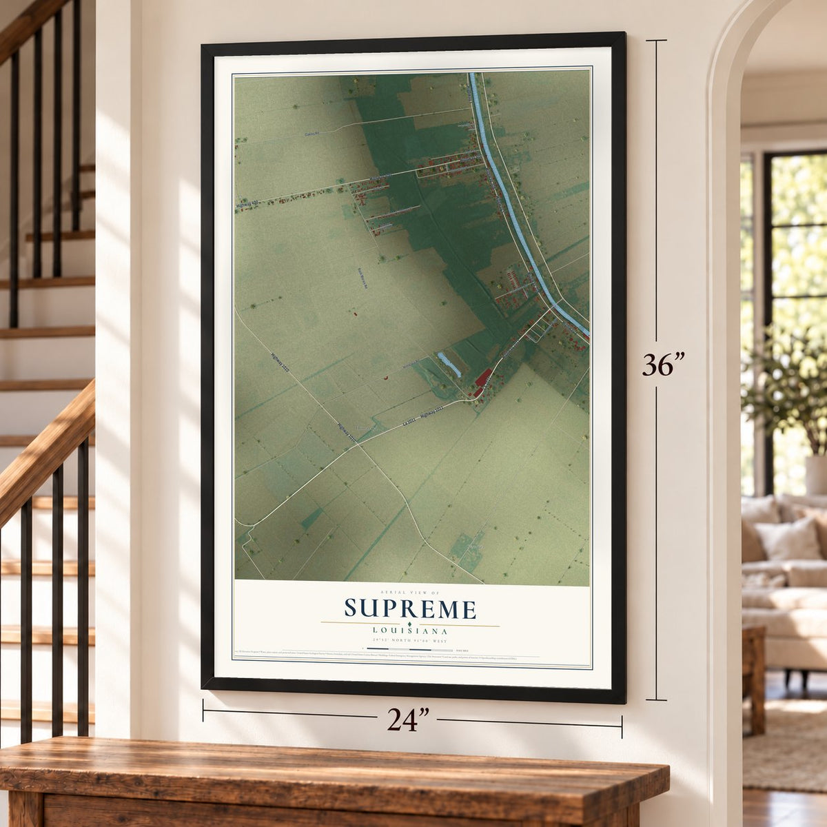 Supreme, Louisiana map, 24 x 36 inch print in a black frame by a staircase