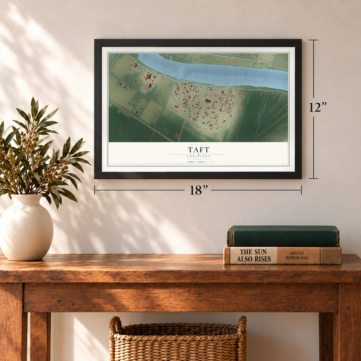 Taft, Louisiana map, 12 x 18 inch print in a black frame in an entryway