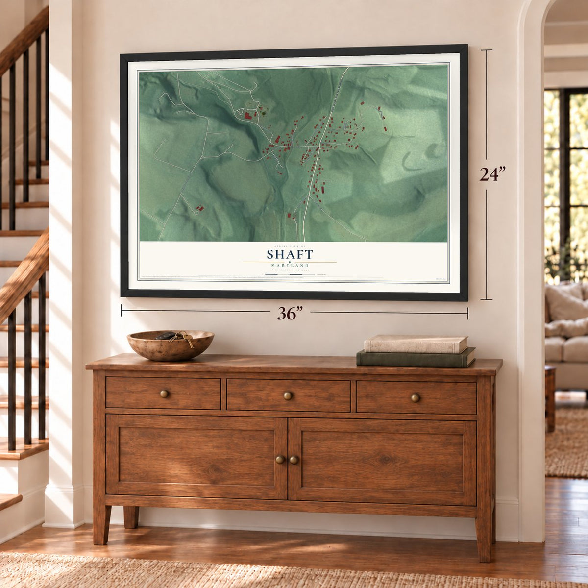 Shaft, Maryland map, 24 x 36 inch print in a black frame above a dresser by a staircase