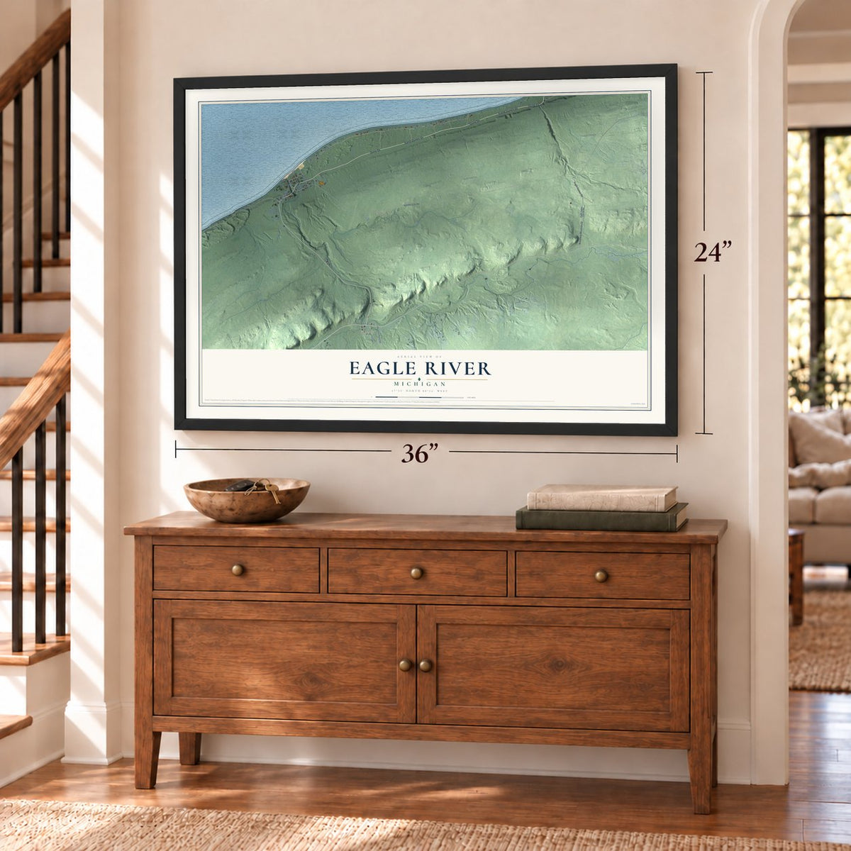 Eagle River, Michigan map, 24 x 36 inch print in a black frame above a dresser by a staircase