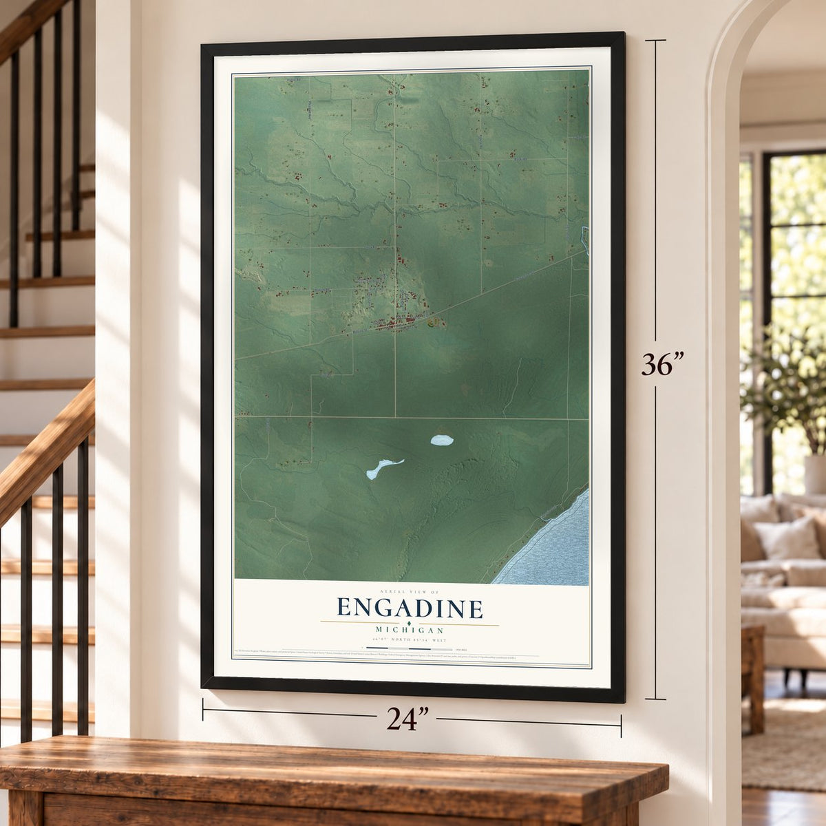 Engadine, Michigan map, 24 x 36 inch print in a black frame by a staircase