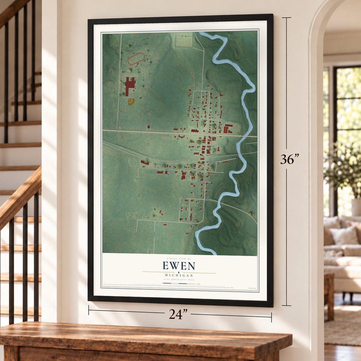 Ewen, Michigan map, 24 x 36 inch print in a black frame by a staircase